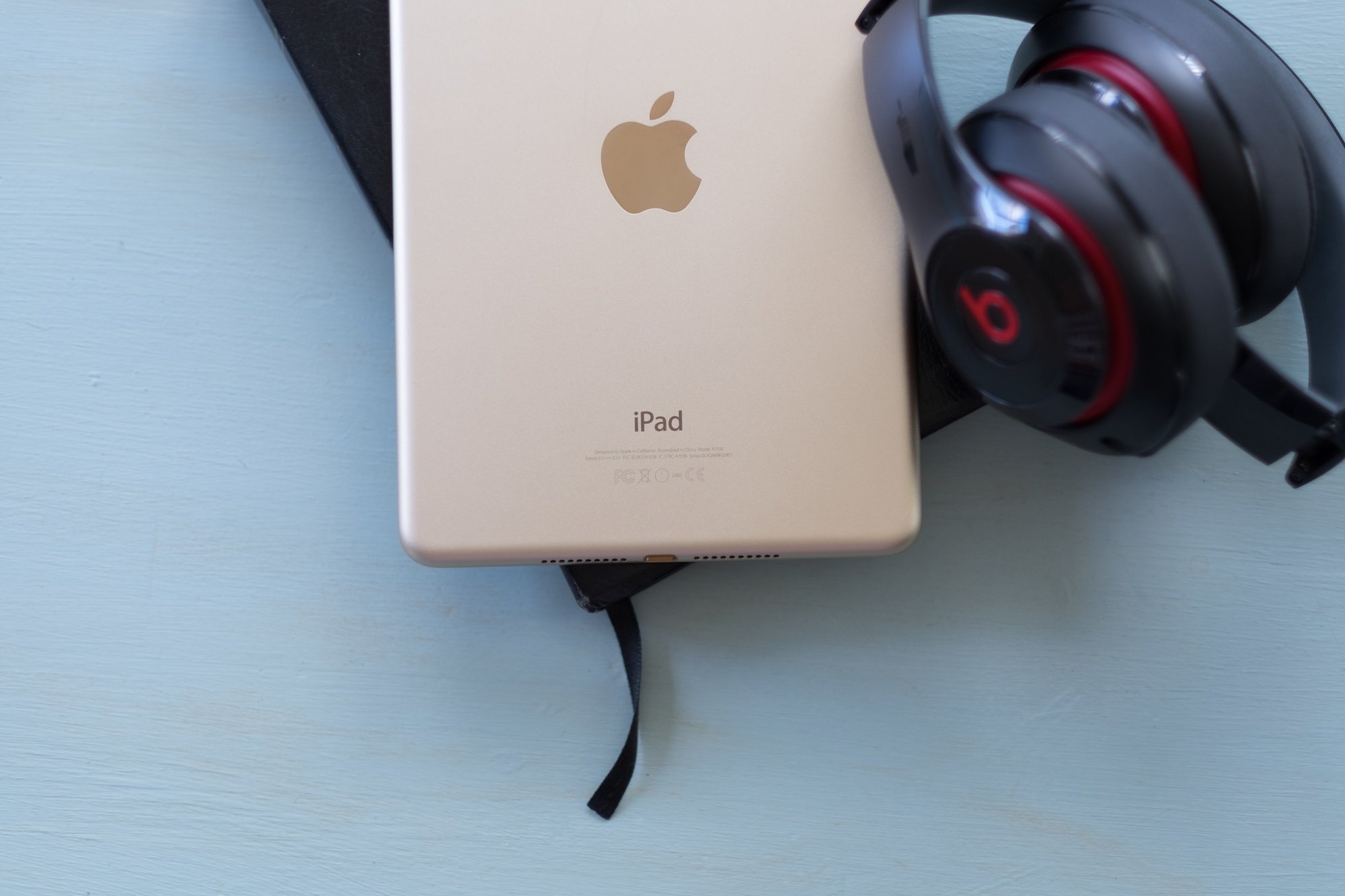 iPad and headphones laying on a table